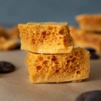 Cut pieces of 3 Ingredient Cinder Honeycomb Toffee showing the crispy holes