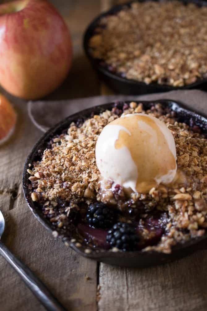 Fresh blackberries and apples showing through the crumble topping