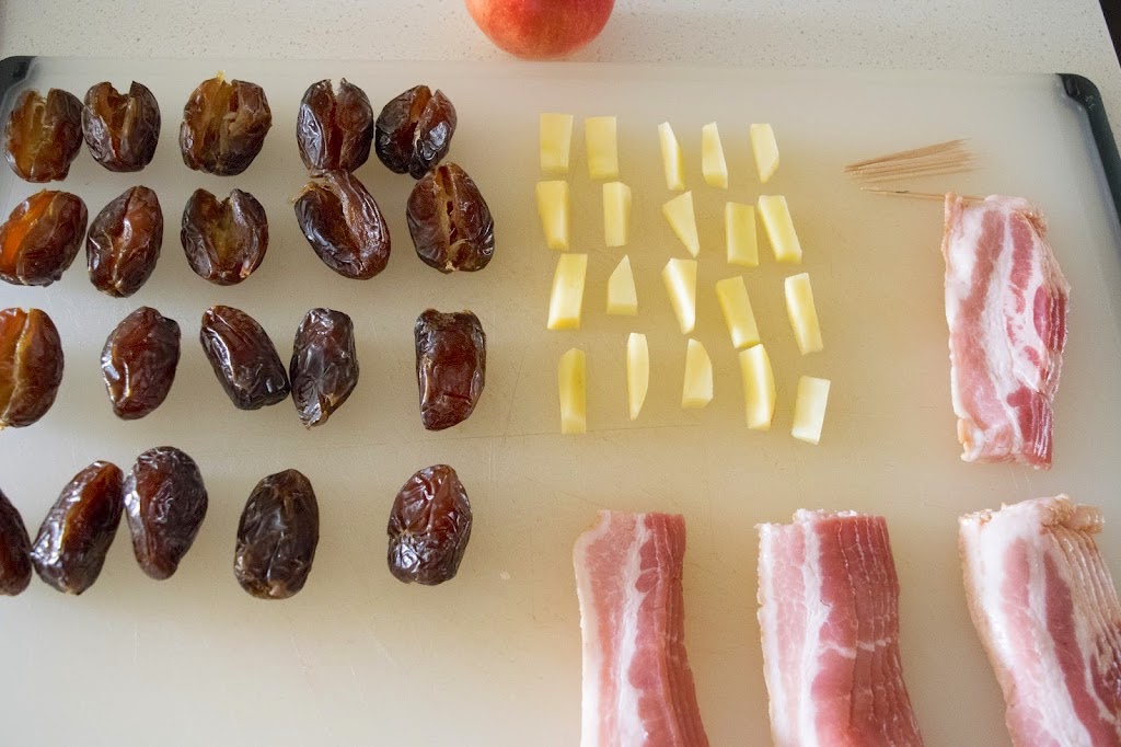 Dates, apple pieces and bacon slices ready to build