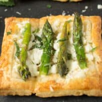 A closeup of a small asparagus tart
