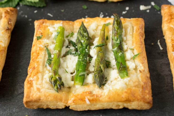A closeup of a small asparagus tart