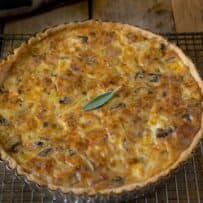 A quiche on a cooling rack