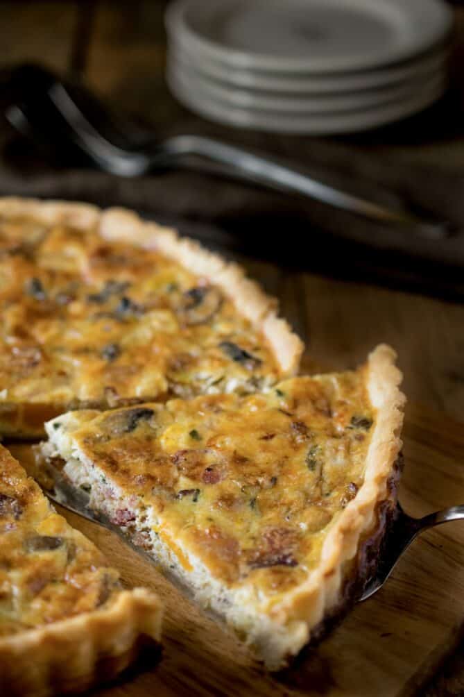 A slice of quiche on a serving spatula
