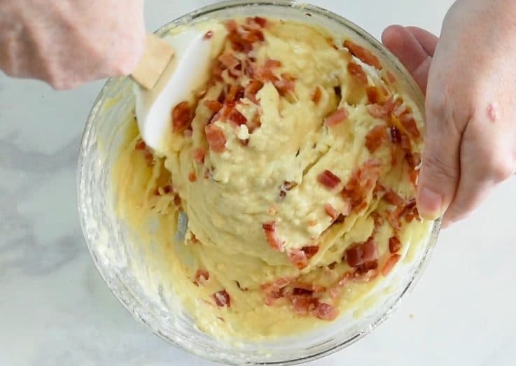 Chopped baking being stirred into the mix