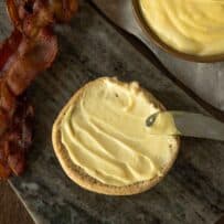 Bacon mayonnaise spread on a burger bun