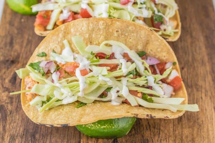 A corn tortilla filled with halibut, pico de gallo, cabbage and Mexican cream