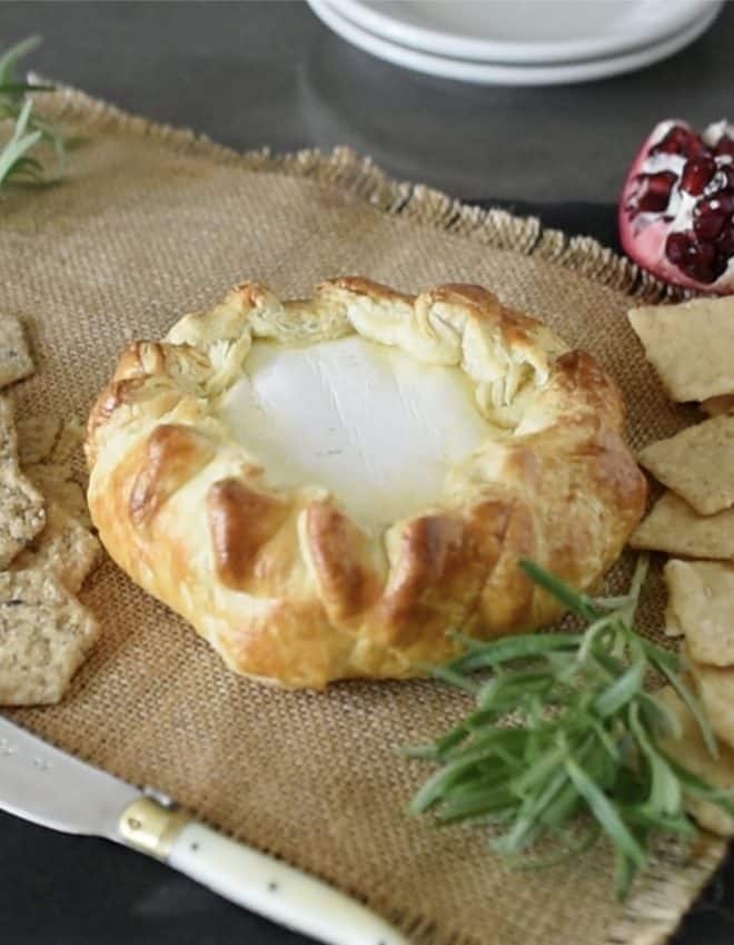 A wheel of brie wrapped in puff pastry and baked