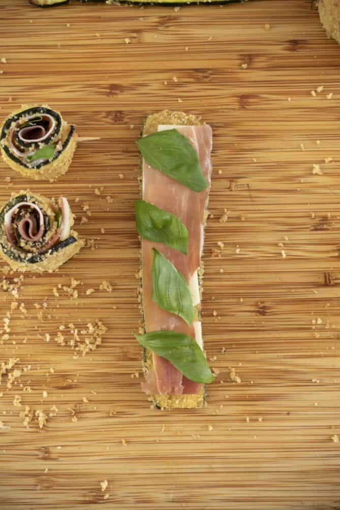 Basil leaves on a zucchini strip