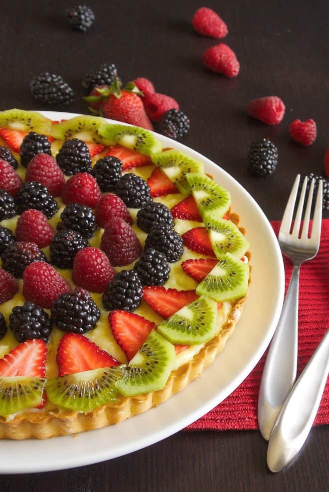 A perfectly golden crust filled with custard and topped with berry fruit and kiwi