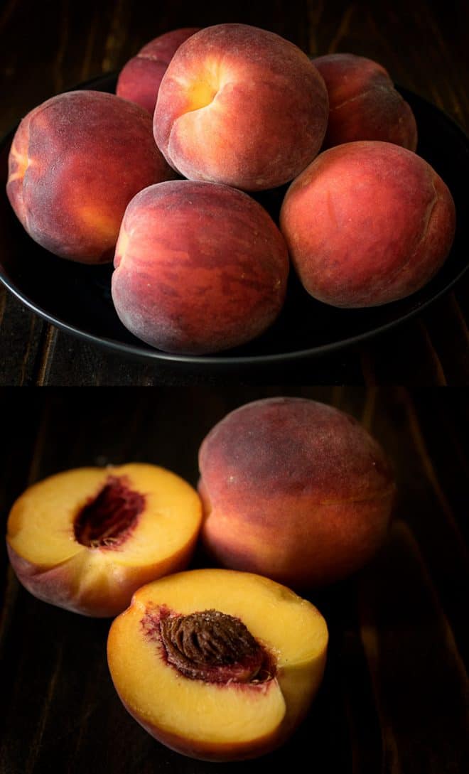 Whole peaches in a bowl and one cut in half