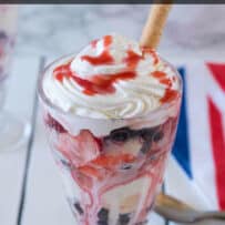 An ice cream sundae in a tall glass with a rolled cookie