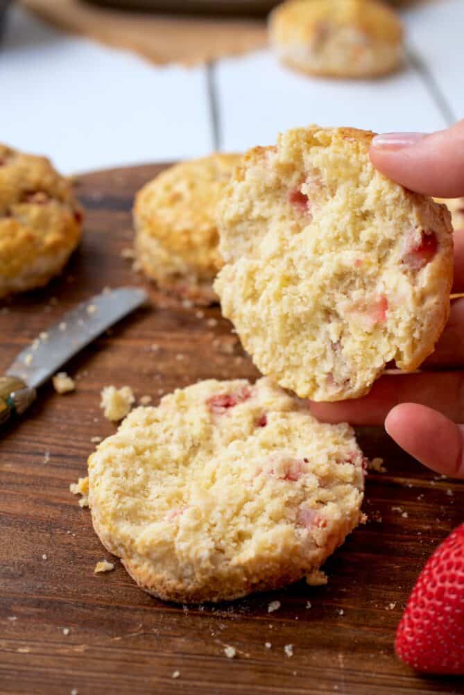 Cutting open a strawberry scone