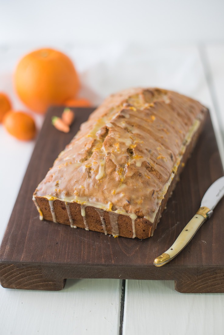 Carrot Ginger Spiced Bread with a knife ready to be sliced