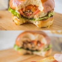 Chipotle chicken burger with a bite taken and dipping a French fry into ketchup