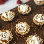 A selection of phyllo dough cups filled with cream and shaved chocolate