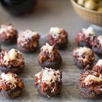 Chorizo stuffed mushrooms on a grey serving platter
