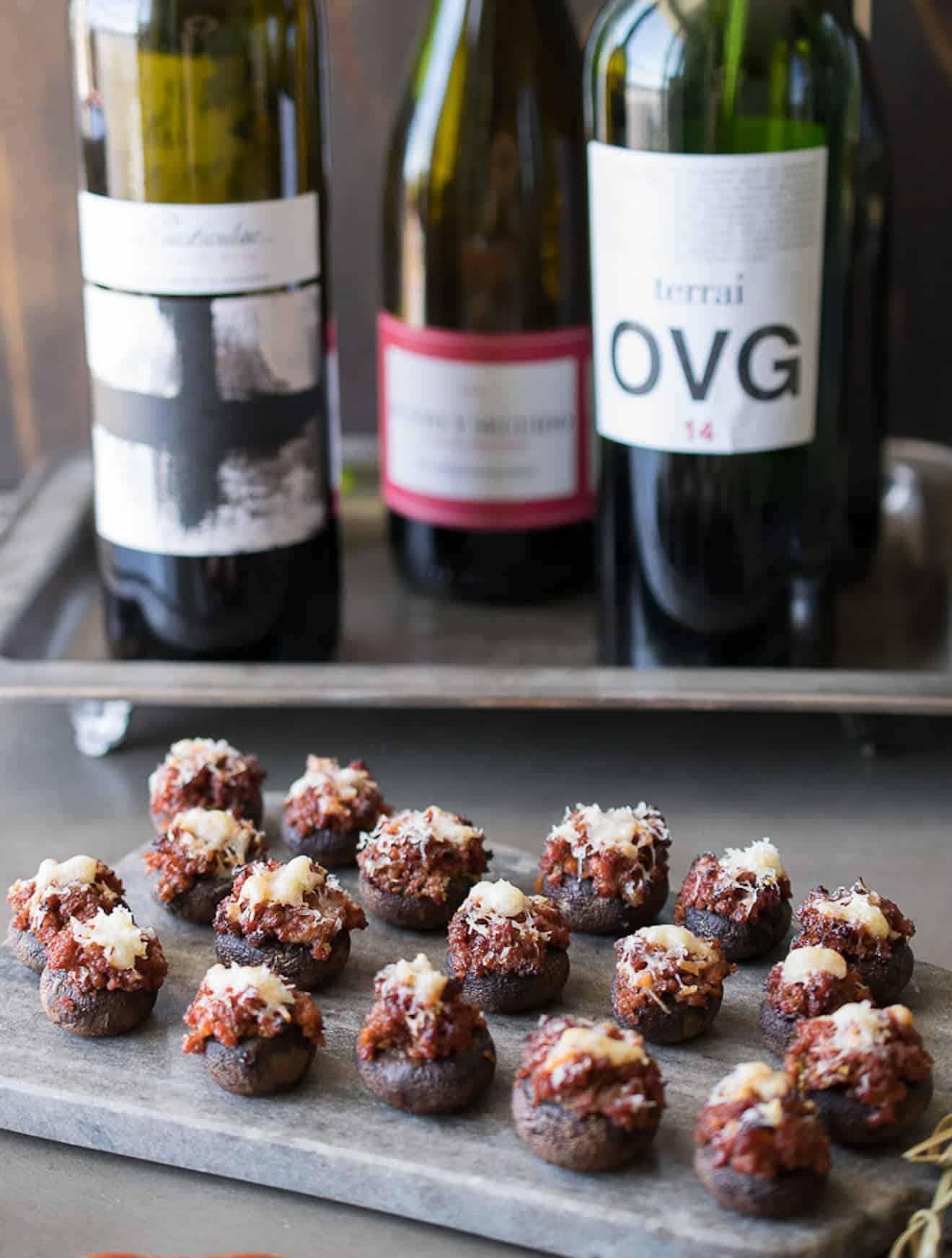 Bottles of wine with chorizo stuffed mushrooms