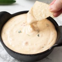 Using a tortilla dip to dip into queso blanco