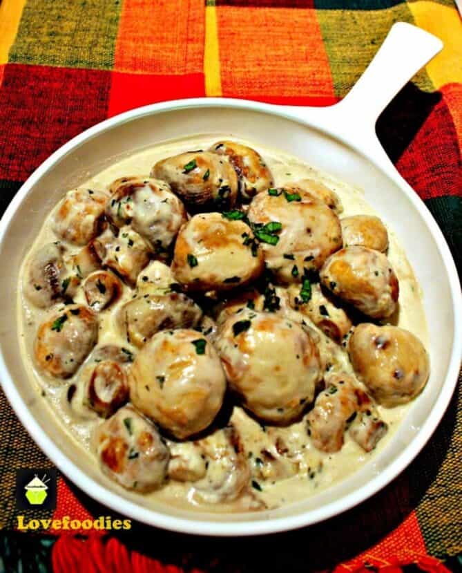 A white dish filled with mushrooms