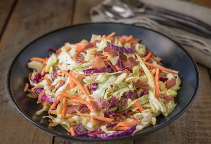 Colorful coleslaw in a black bowl