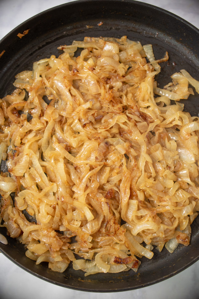 Brown, caramelized onions in a pan