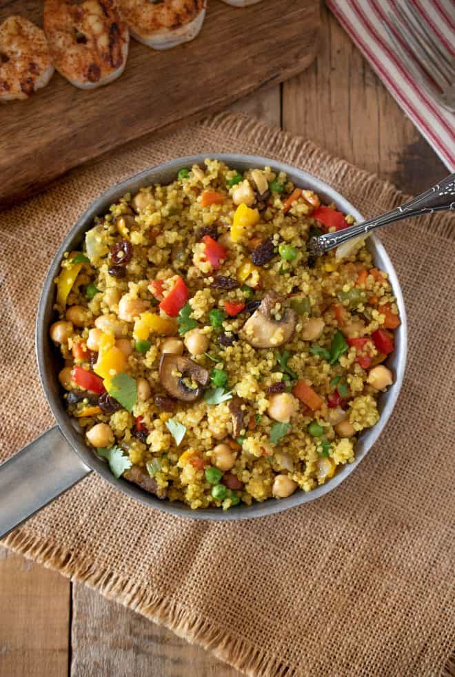 A colorful view from overhead of the pan of curry vegetable quinoa
