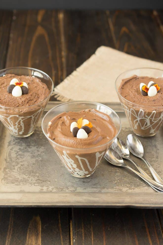 3 glass bowls of dark chocolate espresso mousse with 3 spoons