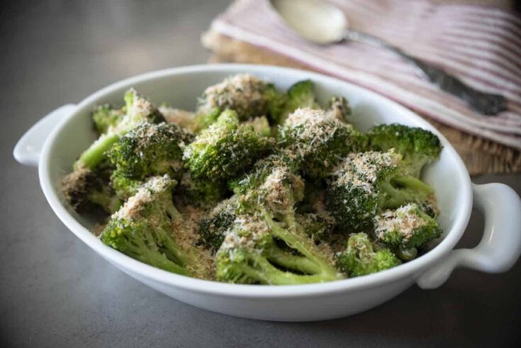 Cooked broccoli in a white oval dish