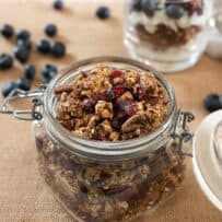 A closeup of granola with nuts and dried fruit