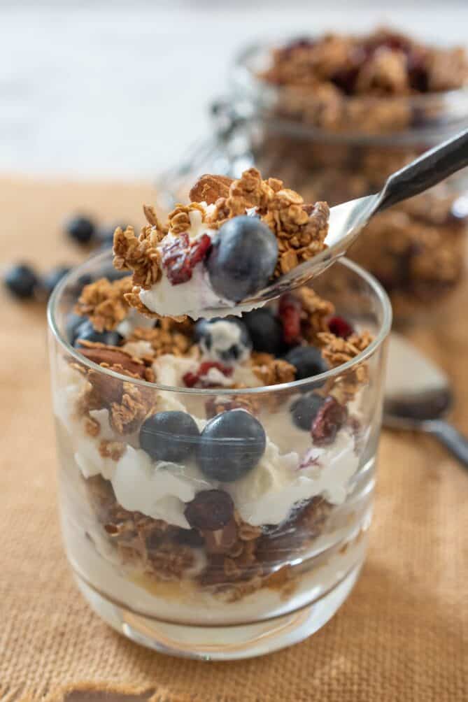 A spoonful of yogurt and granola parfait
