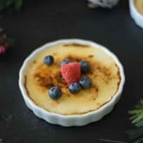Browned creme brûlée topped with fresh berries