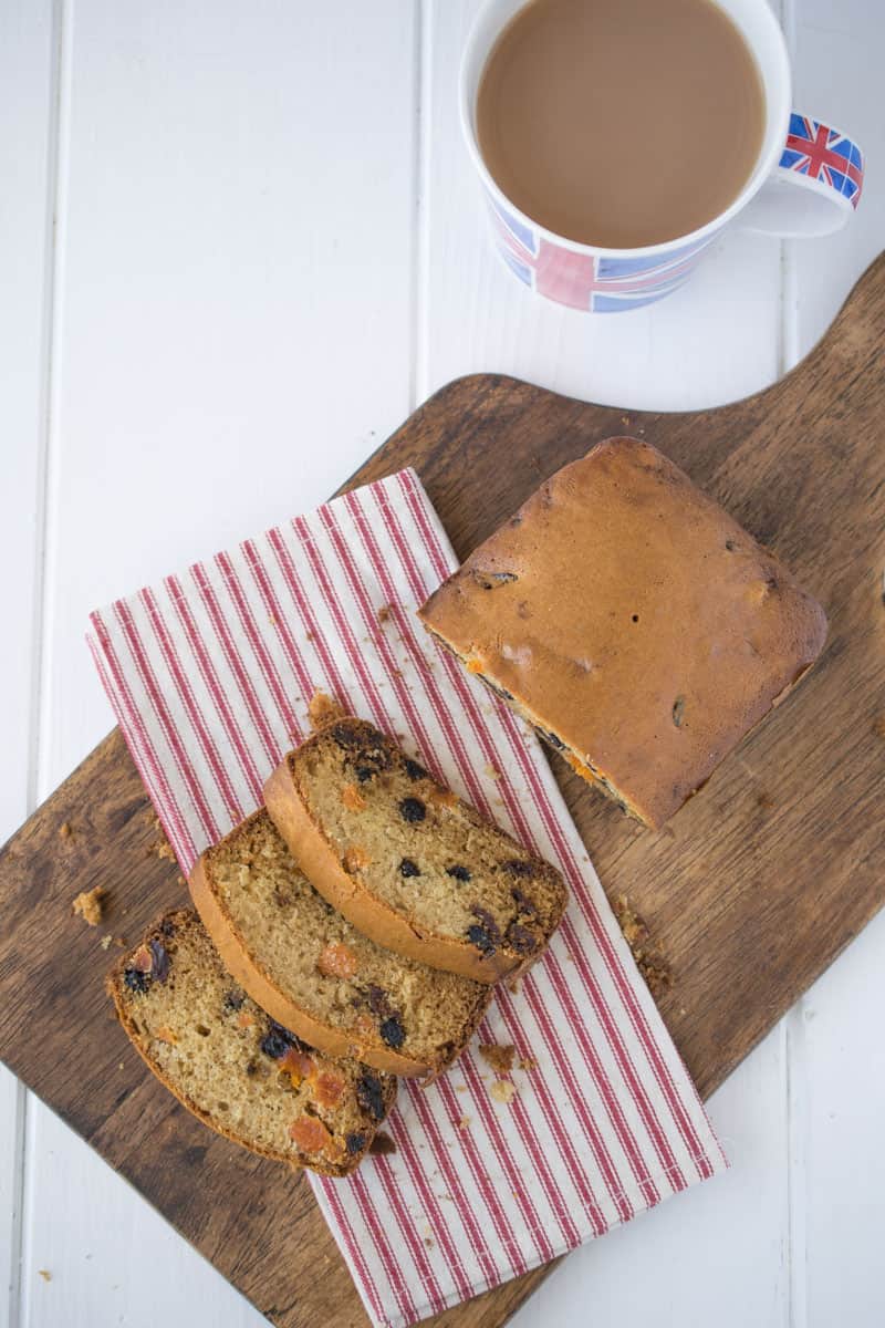 A teacake sliced on a board from above