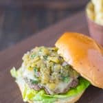 The top bun removed showing the green chile topping