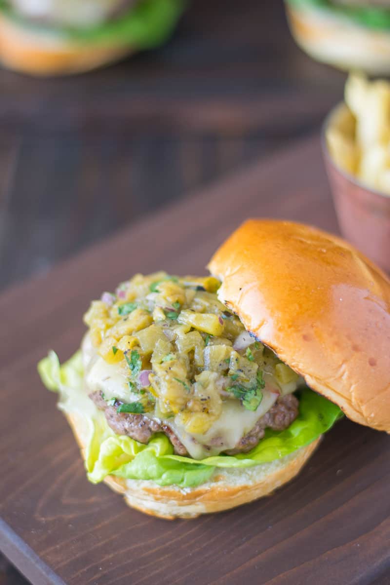 The top bun removed showing the green chile topping