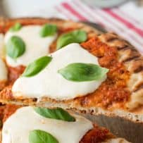 Lifting a slice of pizza off the board