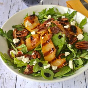 Pear and Crispy Prosciutto Salad ub a white bowl