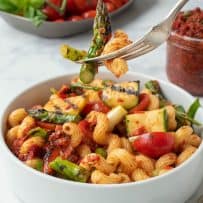 A forkful of pasta and grilled vegetables