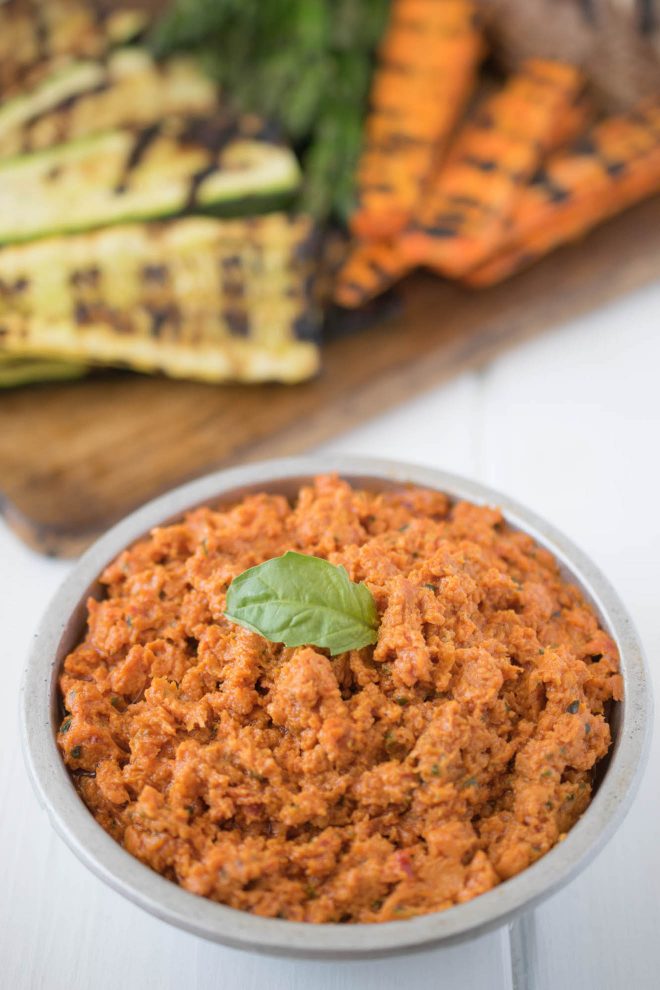 A bowl of creamy sun-dried tomato dip