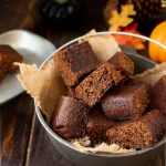 Square slices of parkin cake in a cast iron pot