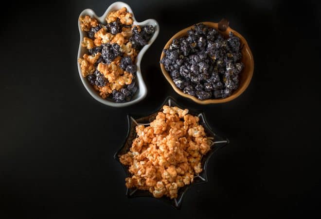 3 bowls of Halloween popcorn, some orange and some black