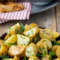 Green herbs over roast potatoes