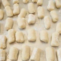 A silver tray of freshly made gnocchi