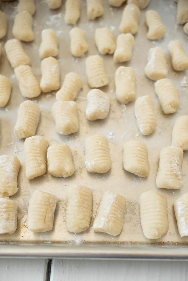 A silver tray of freshly made gnocchi