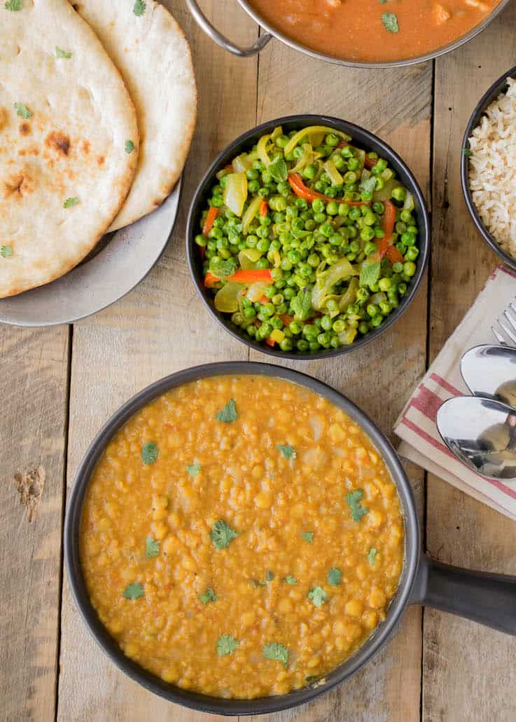 Indian dal with Indian spiced peas, naan bread and chicken tikka maslas