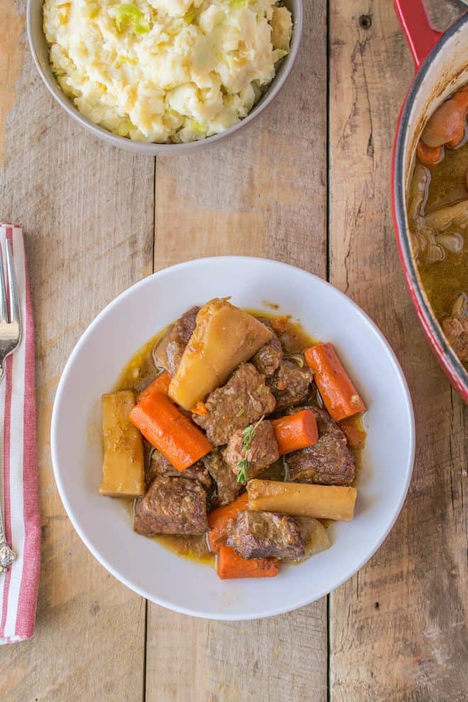 Irish beef & Guinness stew viewed from overhead in a white bowl