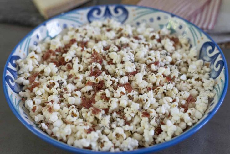 An Italian style decorative bowl filled with popcorn