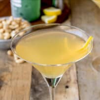 A gin, grand mariner and lemon cocktail in a tall martini glass