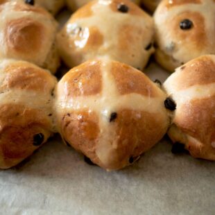 A closeup of lemon hot cross buns