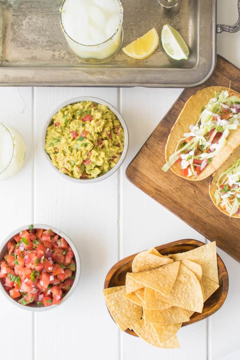 Lemon-lime margarita with tacos on a white board