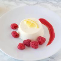 Lemon panna cotta with raspberry sauce. Creamy and sweet, this is an easy dessert that can be made ahead, refrigerate then serve when you're ready for dessert.